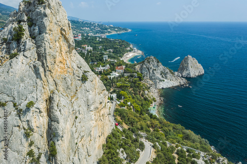 Aerial view of beautiful landscape of Simeiz area. Cat mountain, close up with Diva and Penea rocks inbackground. Beautiful coastline with beaches of Crimea photo