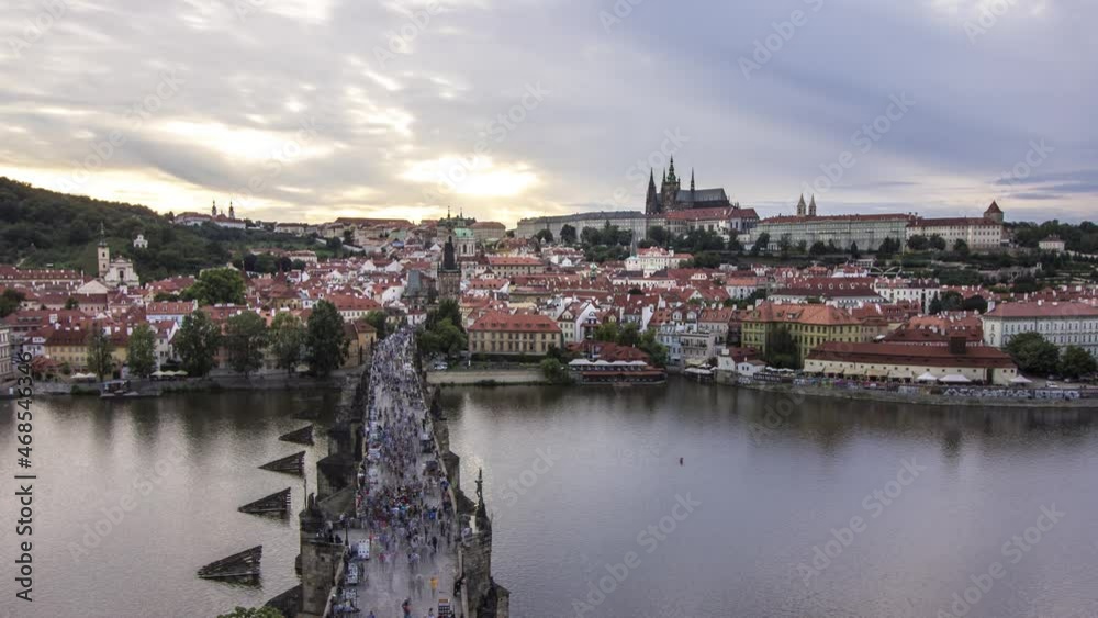 Day to night sunset timelapse from Prague, Czech Republic from Old Town Bridge Tower with a view of Prague Castle, Charles Bridge along with Malá Strana and Hradčany across the Vltava river Day to night sunset timelapse from Prague, Czech Republic from Old Town Bridge Tower with a view of Prague Castle, Charles Bridge along with Malá Strana and Hradčany across the Vltava river