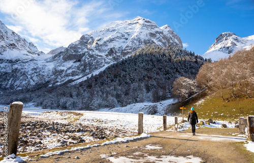 Person walking in the Artiga de Lin, in the Aran valley, located in the Catalan Pyrenees. photo