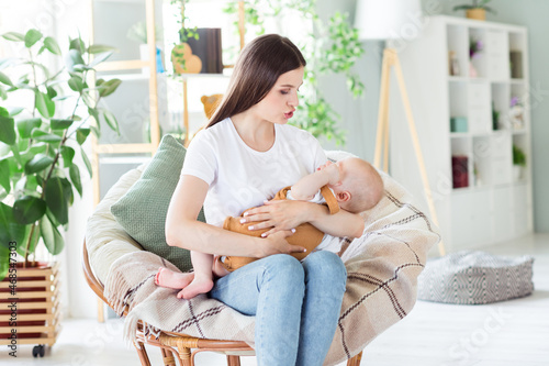 Fényképezés Portrait of attractive careful sweet girl mum mommy holding nursing baby day dre