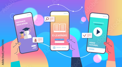 human hands using mobile educational apps on smartphone screens online education e-learning concept