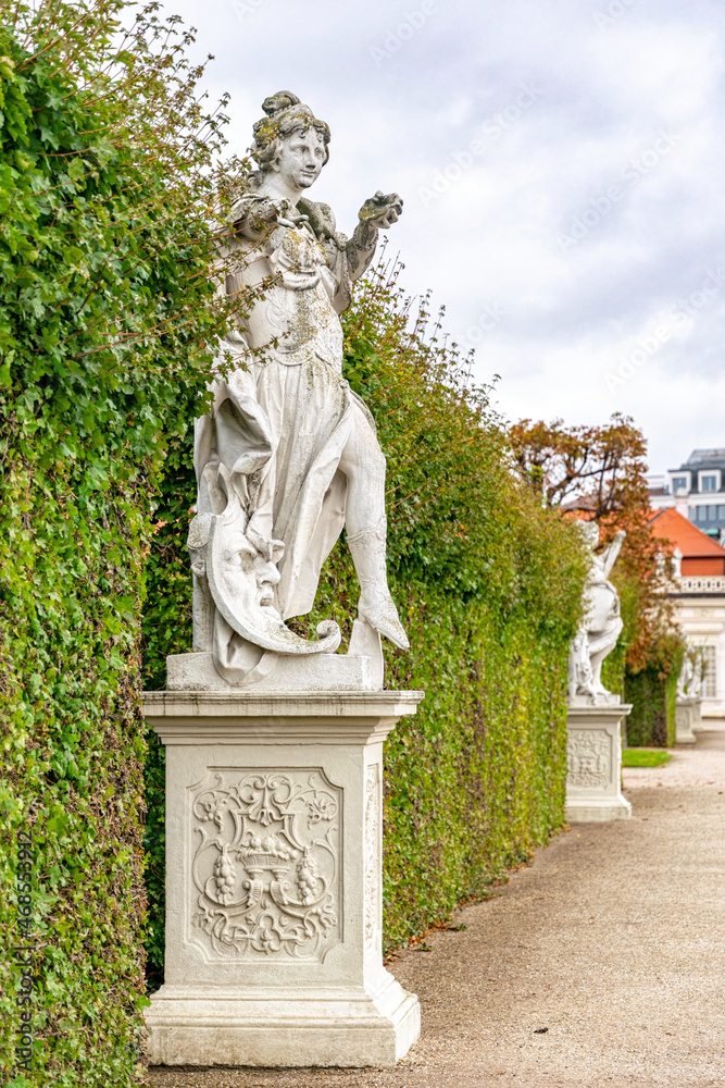 Antique stone statues in the garden of Belvedere Palace, Vienna