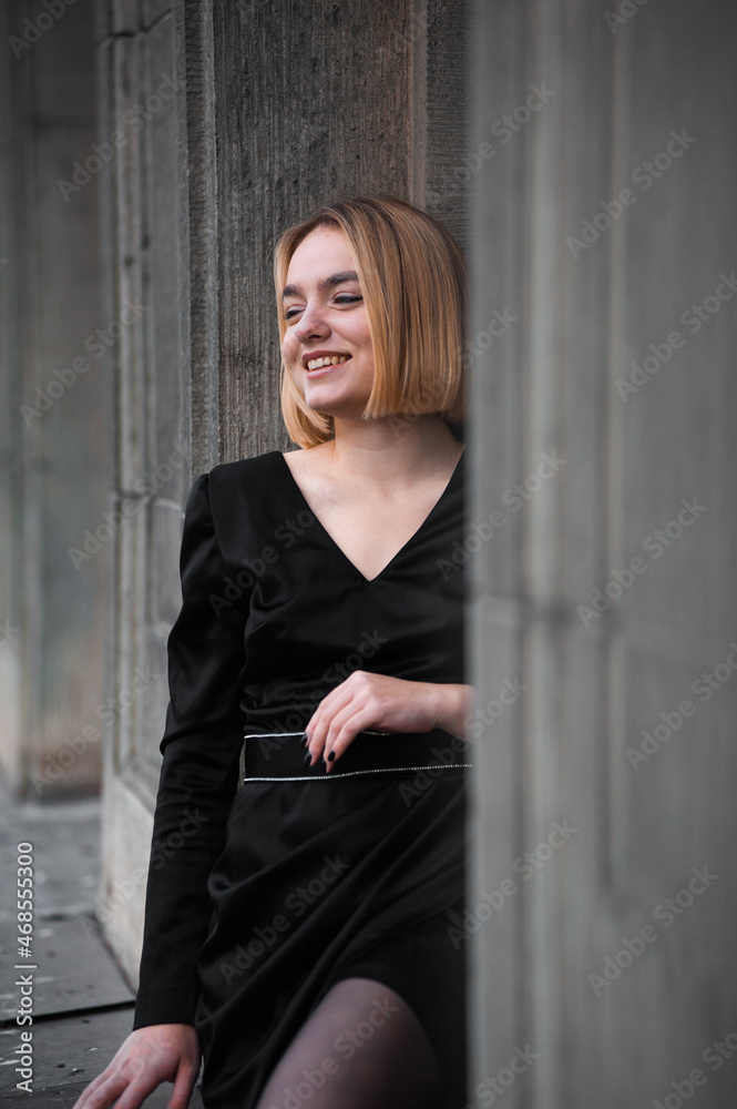 Fototapeta premium Young woman on the city balcony