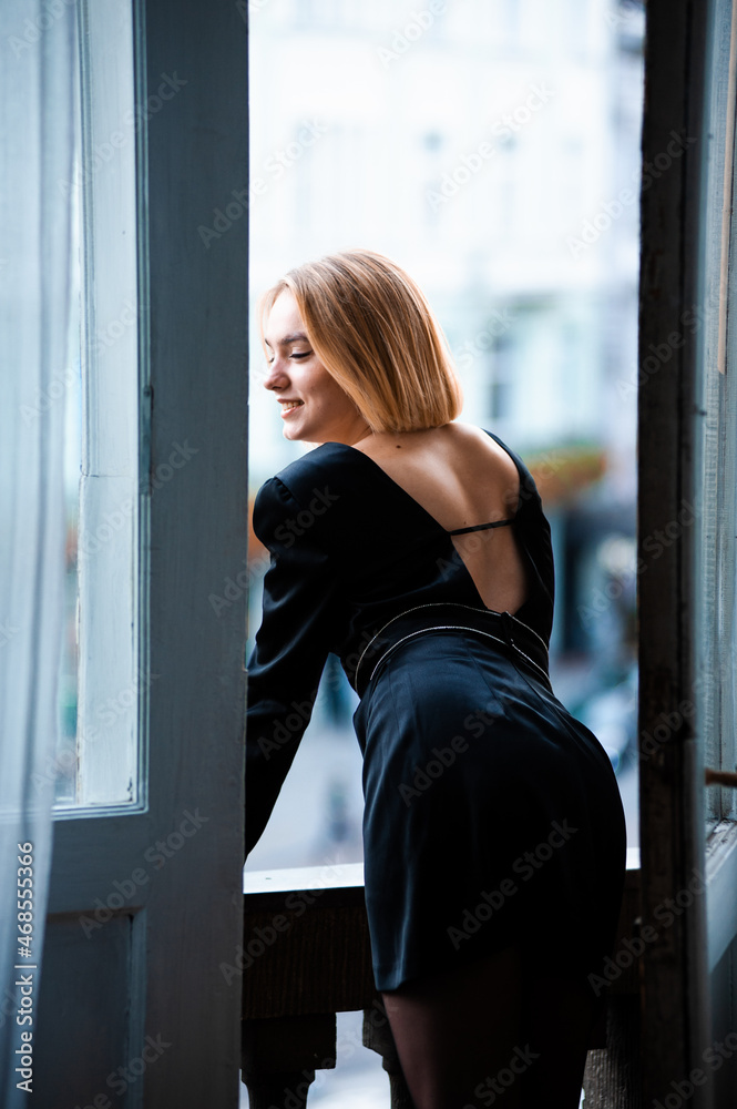 young woman near window at home, closeup young woman near window at home, closeup