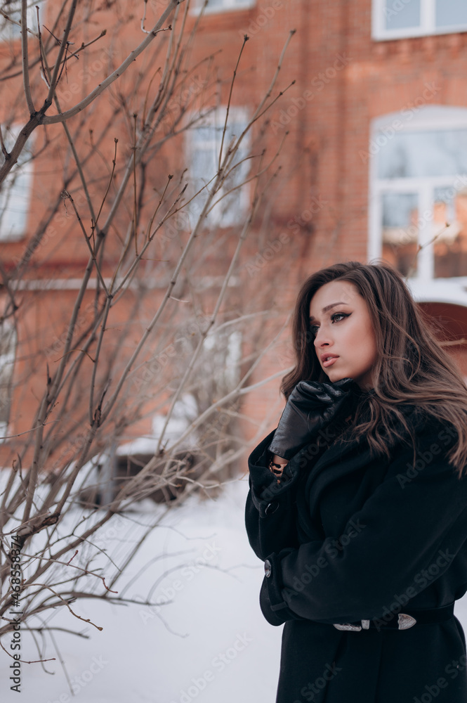 beautiful girl, dark hair, winter, walking around the city, black coat beautiful girl, dark hair, winter, walking around the city, black coat