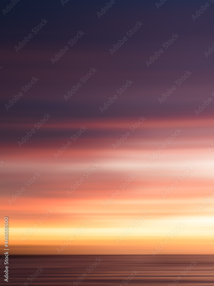 Fototapeta premium Long Exposure sunset, streaky colors in the sky, wallpaper, background