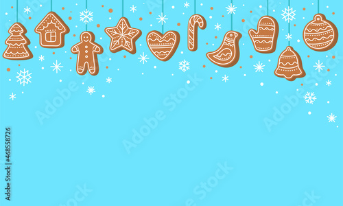 Christmas background. Hanging gingerbread man, tree, house, candy cane, bird, star, bell, heart cookies isolated on blue color with snowflakes. Festive background with Christmas gingerbread. Vector.