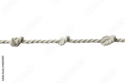 Cotton rope with knots on white background