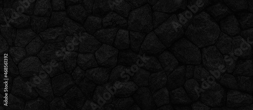 Panorama of Black natural stone wall pattern and background texture