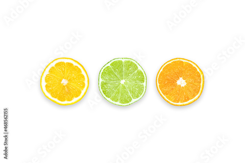 Lemon, Lime and Orange: Three slices of different citrus fruits. Table top view, flat lay, copy space.