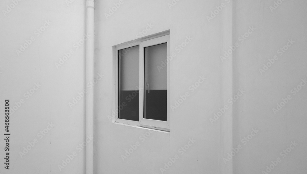 the external facade of the windows of a modern white building. the exterior decoration of the building in an urban area. a simple window frame. the external facade of the windows of a modern white building. the exterior decoration of the building in an urban area. a simple window frame.