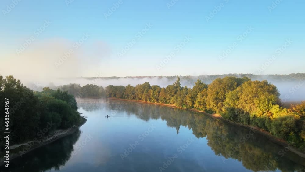 Aerial drone view of nature of Moldova at sunset. River and lush fog above it greenery Aerial drone view of nature of Moldova at sunset. River and lush fog above it greenery
