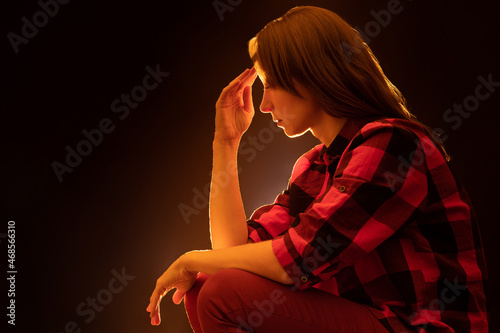 Sad girl on dark background...