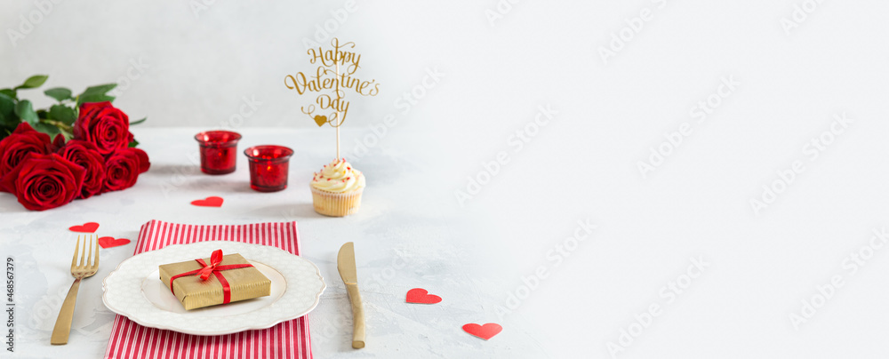 St. Valentine's Day banner with product place or copy space. Red roses, cupcake, hearts and calendar with the date 14 february on white background. Romantic love background. Happy Valentine's Day. St. Valentine's Day banner with product place or copy space. Red roses, cupcake, hearts and calendar with the date 14 february on white background. Romantic love background. Happy Valentine's Day.
