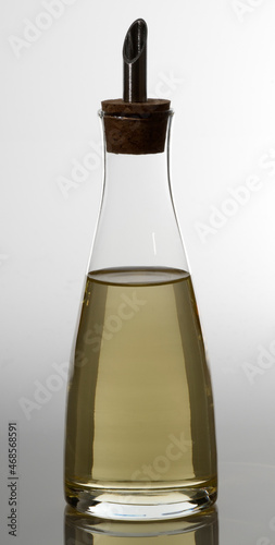 Olive oil dispenser isolated on white, high key