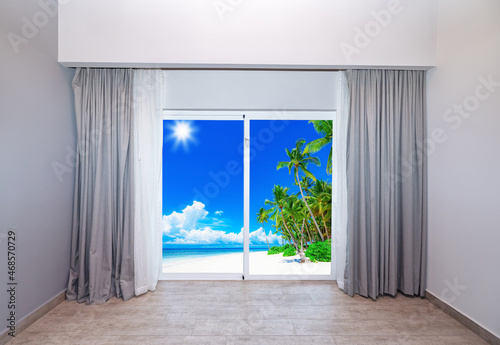 large glass door overlooking the beach