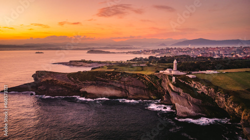 Santander Spain aerial view of the city during epic sunset, drone fly over lighthouse photo