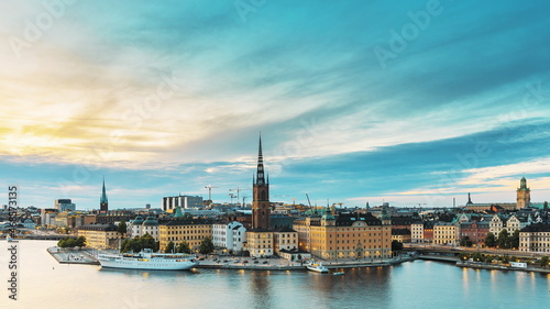 Stockholm, Sweden. Scenic View Of Stockholm Skyline At Summer Evening. Famous Popular Destination Scenic Place In Dusk Lights. Riddarholm Church In Day To Night Transition Time Lapse © Grigory Bruev