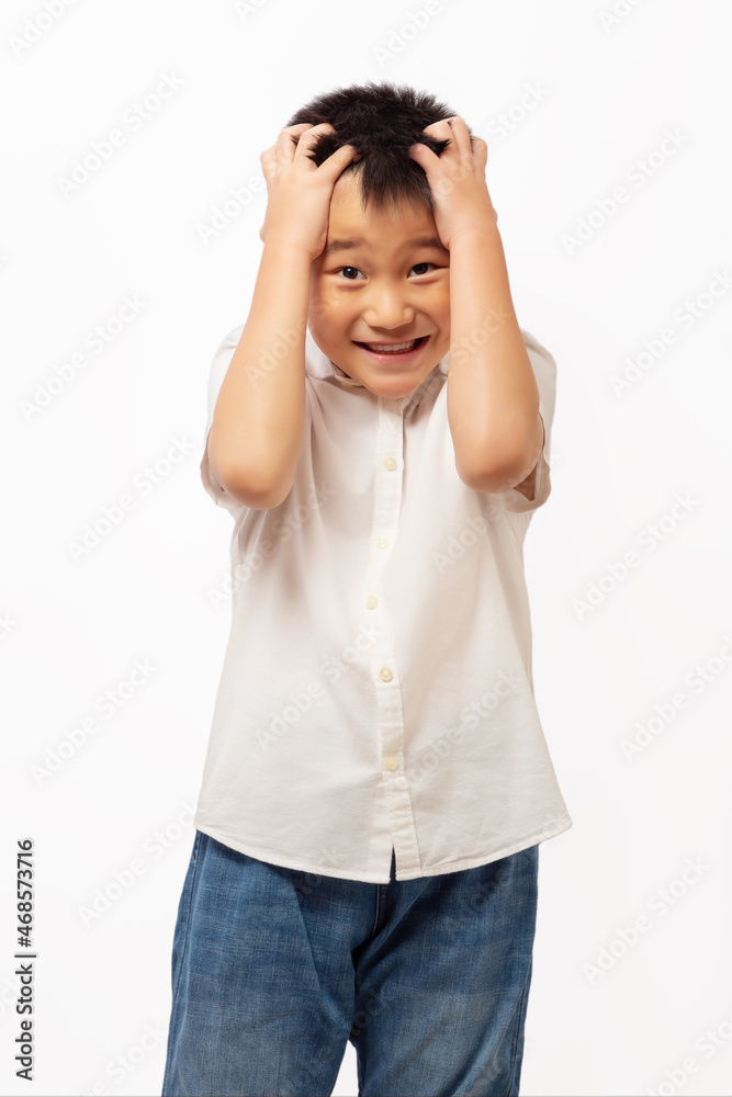 Kid frustrated while thinking with hands on head Kid frustrated while thinking with hands on head