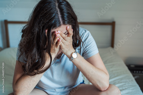 Sad, unhappy woman in depression. Headache, stress, anxiety tension, psychological problems. Poor mental health, visiting psychologist, psychotherapy session. Worries about work,family divorce