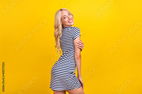 Profile side portrait of attractive cheerful girl having fun posing copy space isolated over bright yellow color background