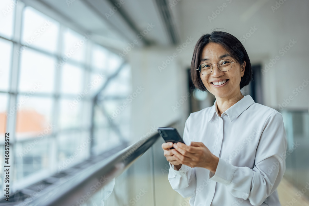 Joyful asian businesswoman, posing for the camera Joyful asian businesswoman, posing for the camera
