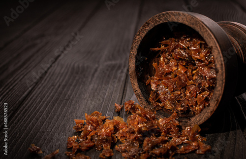 Hookah bowl with tobacco and charcoal for smoking on a dark background. Space for text. Banner