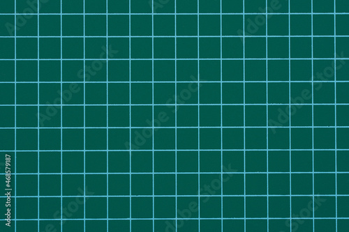 Close up the Green Cutting Board Squared Sheet Texture. 
Top view of green rubber DIY cutting mat.
Green Cutting Board Squared Sheet Texture Background
