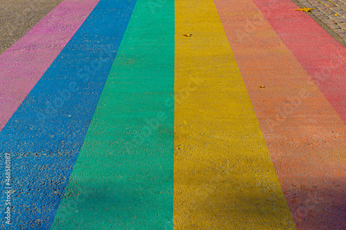 Worldwide LGBTQ community concept, Rainbow pedestrian crosswalk, Colourful colored crossroad, Old and dirty rainbow pedestrians, Symbol of gay, Lesbian, Bisexual and transgender, Social movements. © Sarawut