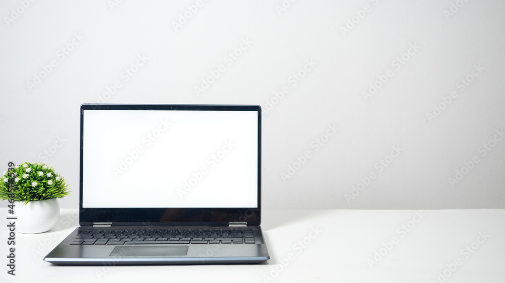 Laptop blank white screen on the table copy space Laptop blank white screen on the table copy space