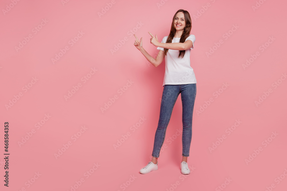 Portrait of charming reliable lady indicate fingers blank space promoting novelty on pink background Portrait of charming reliable lady indicate fingers blank space promoting novelty on pink background