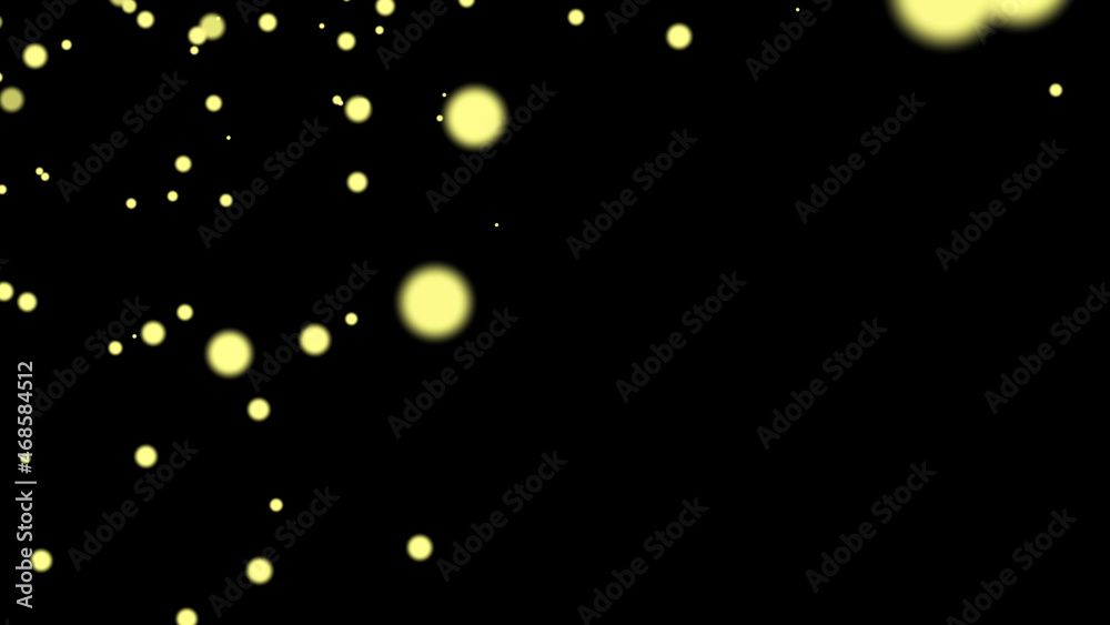 yellow flying particles on a black background. dark abstract background ...