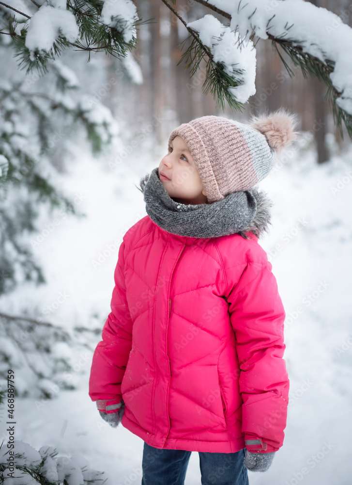 Child in winter. A little girl, playing in the winter outside. Child in winter. A little girl, playing in the winter outside.