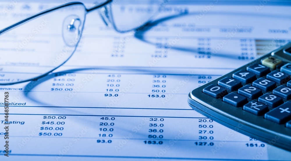 Eyegalsses and Calculator on Financial Figures Eyegalsses and Calculator on Financial Figures