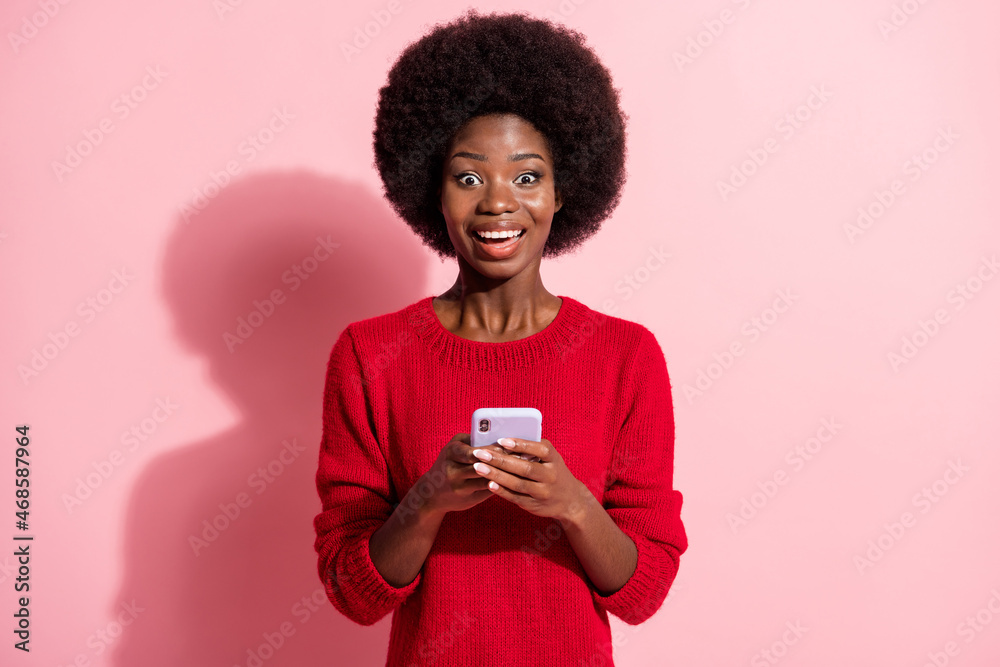 Portrait of attractive amazed cheerful girl using gadget app 5g browsing media smm isolated over pink pastel color background Portrait of attractive amazed cheerful girl using gadget app 5g browsing media smm isolated over pink pastel color background