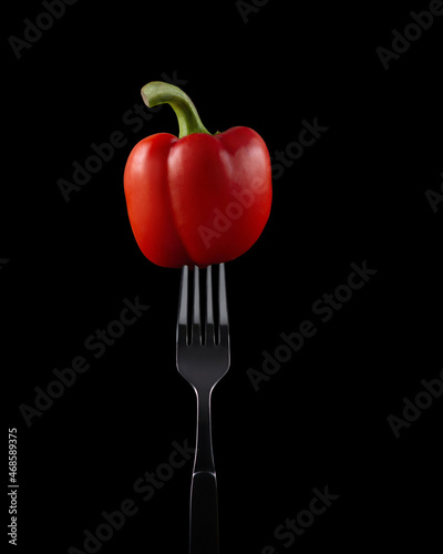 red bell pepper on a fork © Berzyk