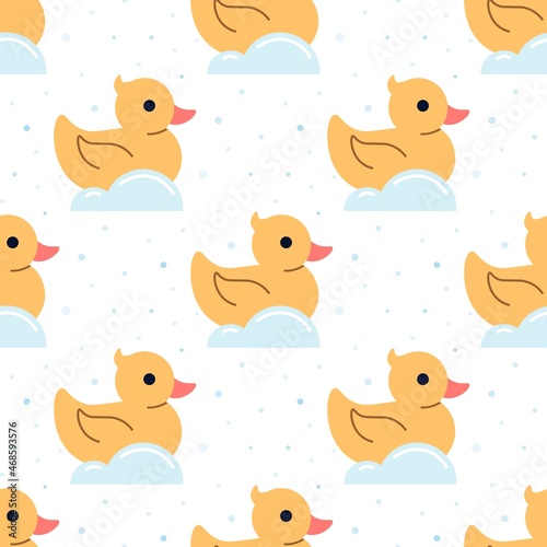Seamless pattern with yellow ducks. Rubber ducks and soap bubbles on a white background. Cute flat illustration.