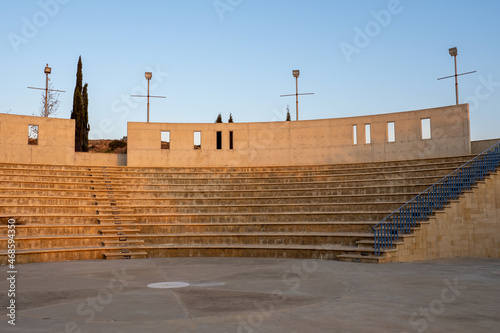 Open-air amphitheater tribune in the rays of the sunset