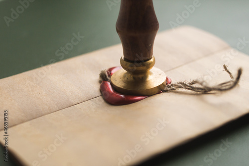 Sealing wax in a candle, a bar. Envelope with wax seal