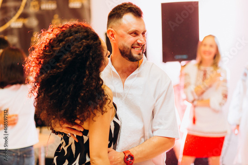 Kharkiv, Ukraine 17.08.21 People dancing salsa on the dance floor photo