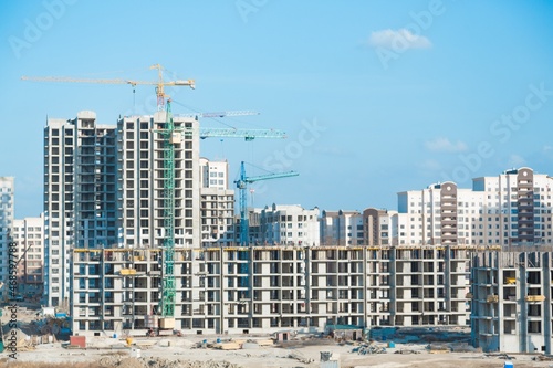 Lots of tower Construction site with cranes and building with blue sky background