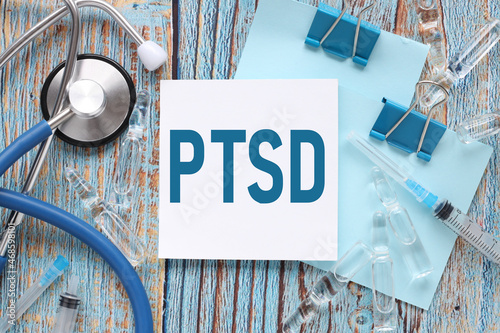 PTSD. Stethoscope with notepad on the doctor's table. sticker on the doctor's table with place for text. Medical diagnosis or doctor's prescription mockup. medicine concept photo