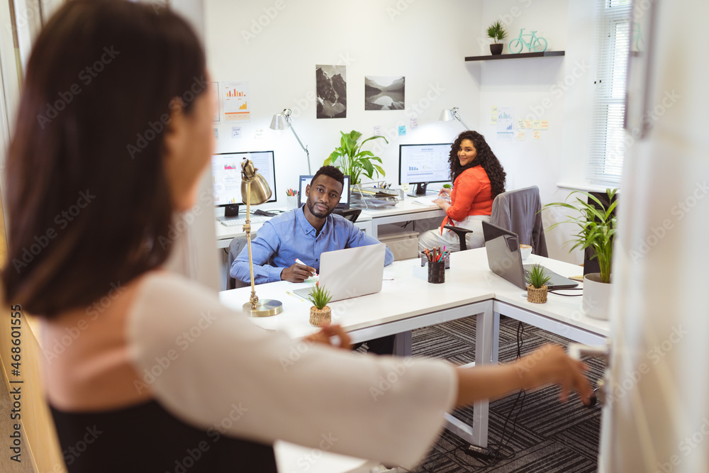 Happy diverse group of business people working together in modern office Happy diverse group of business people working together in modern office