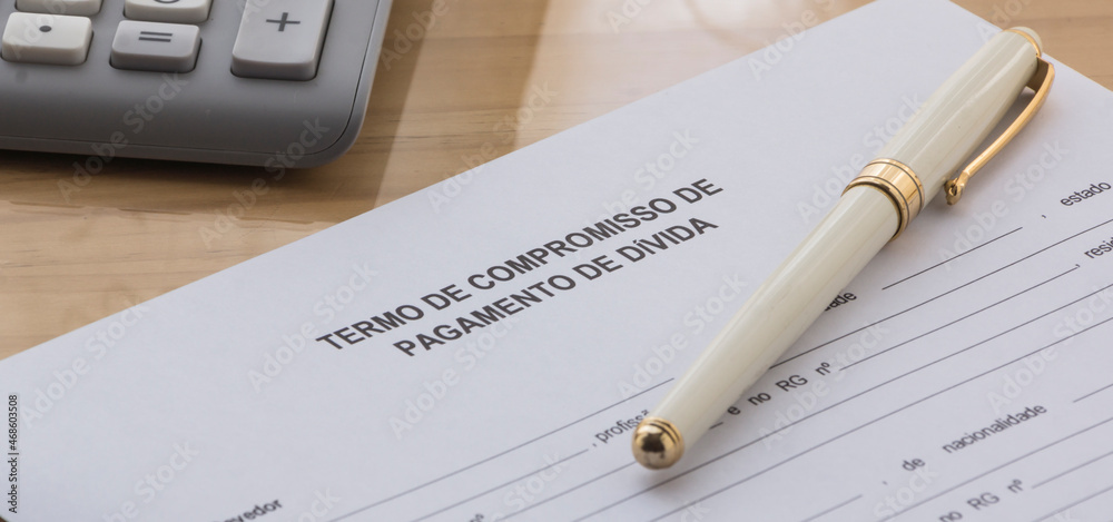 A Debt Payment Commitment Term in portuguese Language on the desk. Term of commitment form
A Debt Payment Commitment Term in portuguese Language on the desk. Term of commitment form