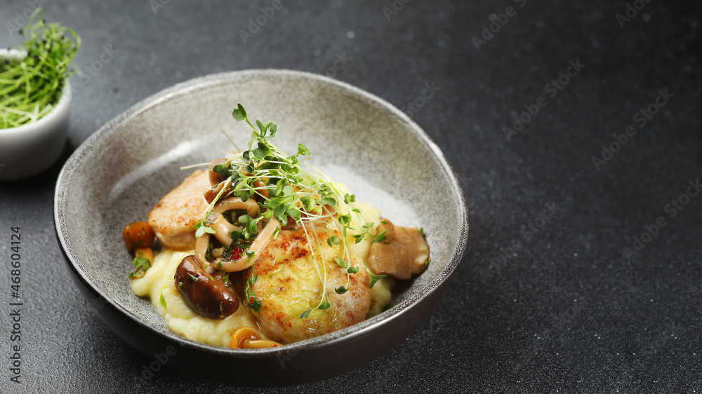 mashed potatoes with cutlets and mushrooms in ceramic plate. mashed potatoes with microgreen on dark concrete table mashed potatoes with cutlets and mushrooms in ceramic plate. mashed potatoes with microgreen on dark concrete table