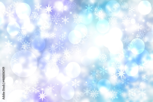 Abstract blurred festive light blue pink winter christmas or Happy New Year background with shiny blue and white bokeh lighted snowflakes and stars. Space for your design. Card concept.