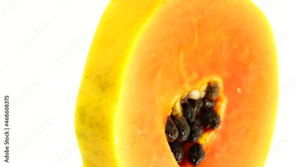 4K Half ripe papaya fruit with seeds. Fragrant tropical fruit pulp