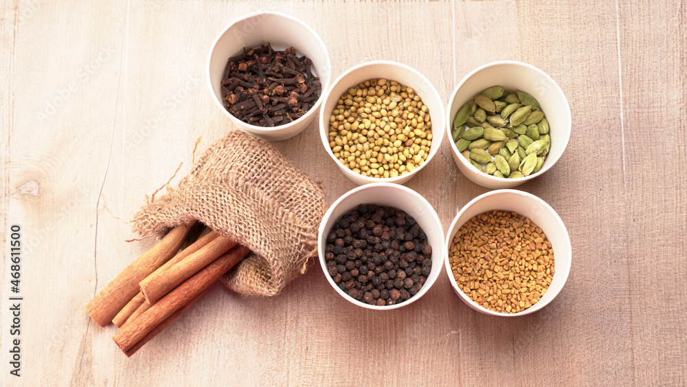Collection of indian Spices and herbs. Food and cuisine ingredients on wooden background. Collection of indian Spices and herbs. Food and cuisine ingredients on wooden background.