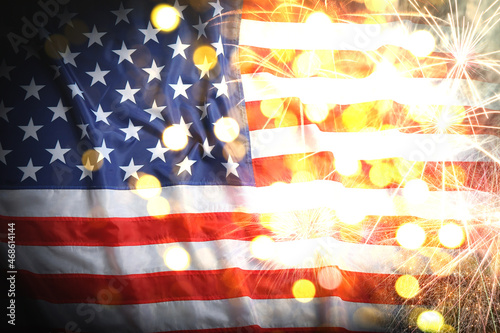 Independence Day of USA. National American flag and fireworks, bokeh effect