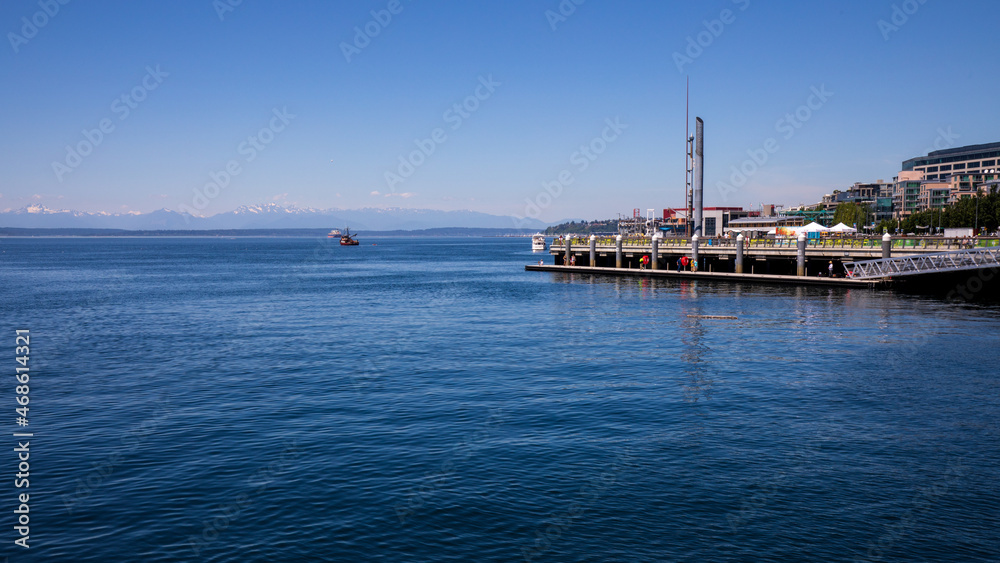 Seattle, Washington, USA - June 4 2021: Olympic National Park skyline from Seattle in summer. View from Seattle Aquarium.